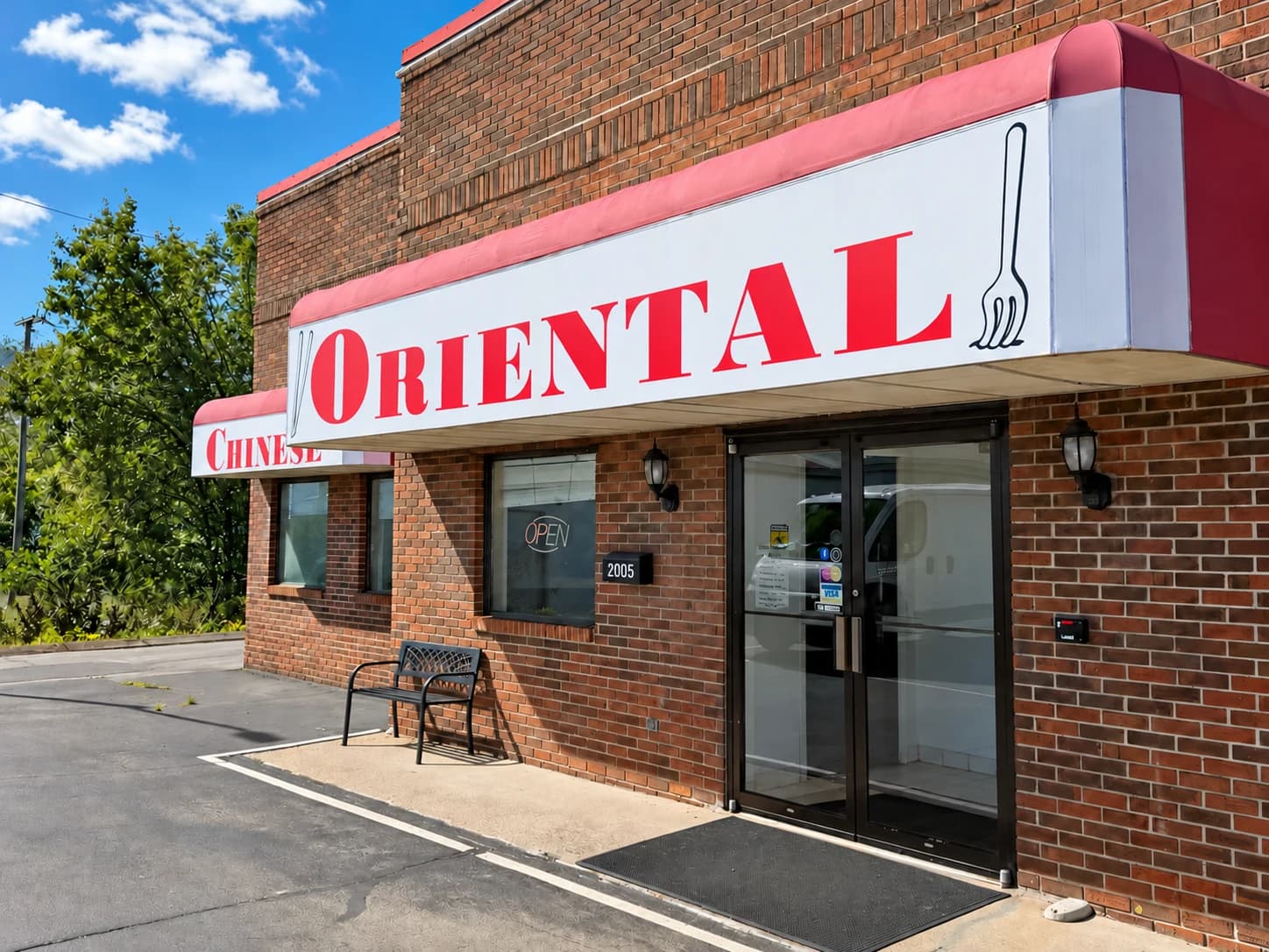 Oriental Restaurant's brick storefront, red sign, and entrance at 2005 N Locust Avenue